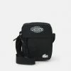 Lacoste UNISEX EXCLUSIVE - Sac Bandoulière - Noir Blanc