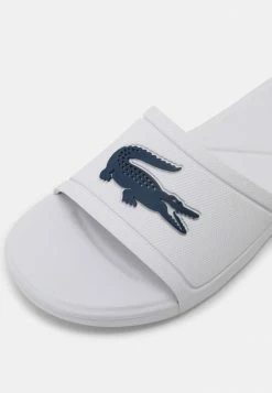 Lacoste SLIDE UNISEX - Sandales De Bain - White/dark Blue -Lacoste Soldes Magasin bdac43c66f0f4150bab76c283140bc14